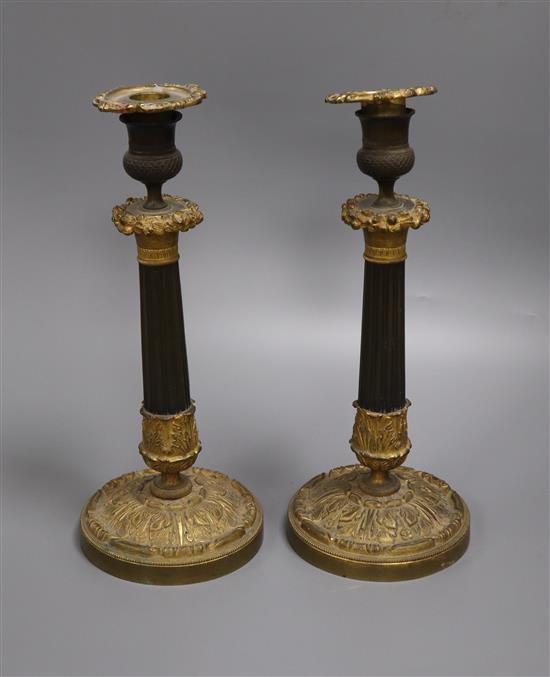 A pair of William IV bronze and ormolu candlesticks height 30cm